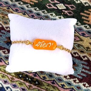 Hand crafted one of a kind orange glass Jerusalem gold plated bracelet.